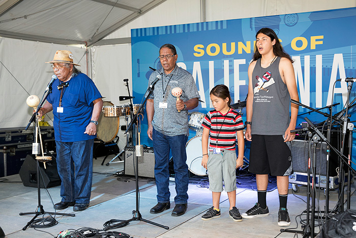 Preston Arrow-weed sharing songs and stories along with Kumeyaay tribe members Stan Rodriguez, Hwaa Hawk, and Raymond Martinez. Photo by Francisco Guerra, Ralph Rinzler Folklife Archives