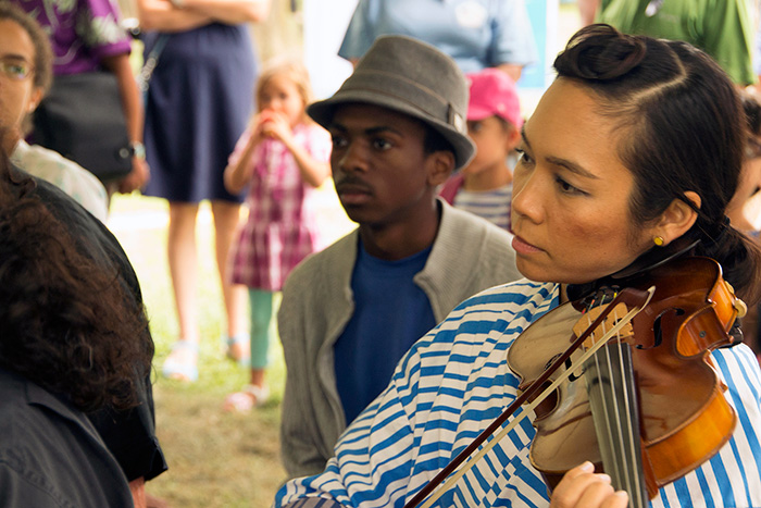 Tylana Enomoto added a layer of violin to the collective songwriting workshop with members of Quetzal and many creative visitors in The Studio. Photo by Gregory Gottlieb, Ralph Rinzler Folklife Archives