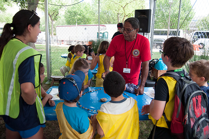 We had many summer camp visitors today. Stan Rodriguez corralled a group of them to learn some Native Kumeyaay games. Photo by Joe Furgal, Ralph Rinzler Folklife Archives