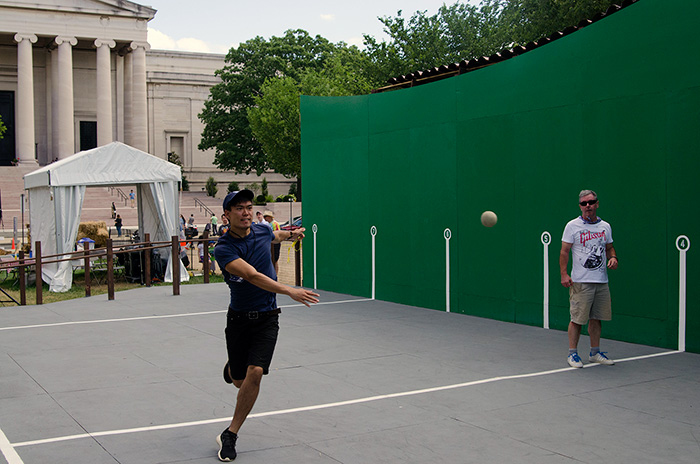 While waiting to take the group photo, several Basque participants joined in a friendly round of <em>pilota</em> Folklife video producer Albert Tong joined in. Photo by Josh Weilepp, Ralph Rinzler Folklife Archives