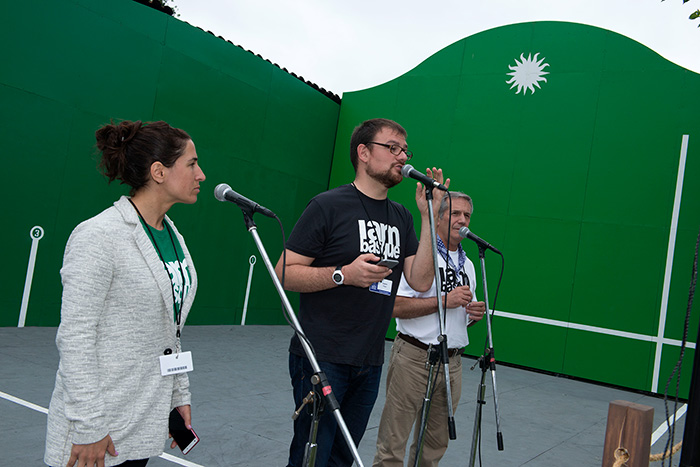 The <em>bertsolaris</em> shared their Basque oral poetry tradition at the Frontoia, improvising verses about Independence Day and finding love. Left to right: Irati Anda, Xabier Paya, and Martin Goicoechea. Photo by Walter Larrimore, Ralph Rinzler Folklife Archives