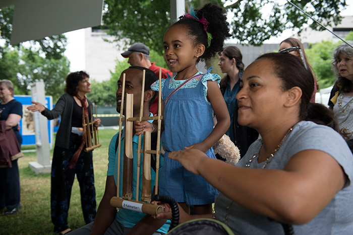 House of Angklung, an Indonesian performance group in D.C., brought their bamboo rattles for visitors to play. Each instrument makes only one note, but played together as a community we can make a melody. Today's melody was "Twinkle, Twinkle, Little Star." Photo by Walter Larrimore, Ralph Rinzler Folklife Archives