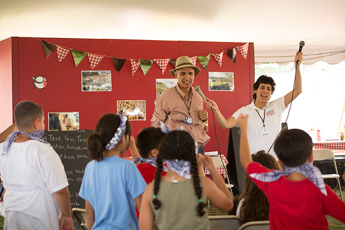 Singers from the Biotzetik Basque Choir from Boise, Idaho, led a Basque song session for children in the Txiki-Txoko Kids' Corner. Photo by Pruitt Allen, Ralph Rinzler Folklife Archives