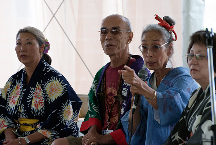 In an <em>On the Move</em> discussion about the Japanese American experience, <em>FandangObon</em> members Nancy Sekizawa, George Abe, Nobuko Miyamoto, and Elaine Fukumoto, shared their families' stories living in internment camps. Photo by Ronald Villasante, Ralph Rinzler Folklife Archives