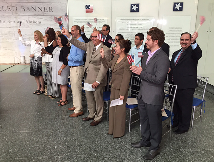 New immigrants to the United States celebrate their naturalization. Photo courtesy of of U.S. Citizenship and Immigration Services