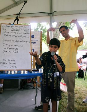 Sandino and Quetzal Flores encourage the crowd to sing along. Photo by Ying Diao srcset=