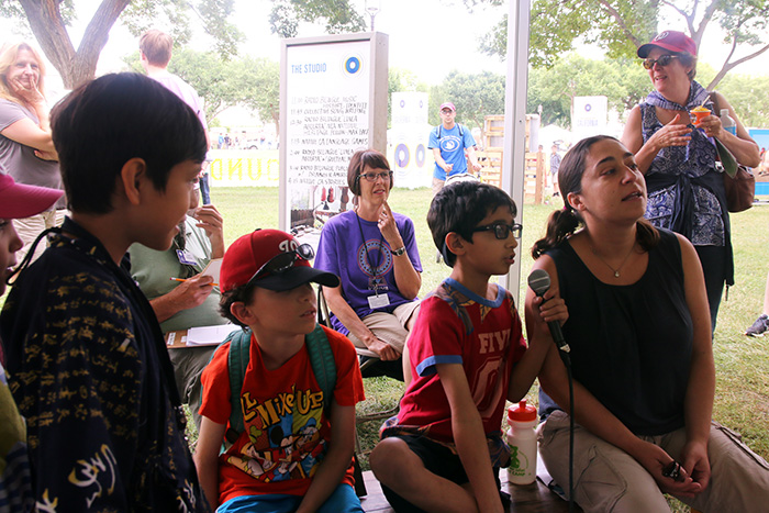 A young visitor leads the melody. Photo by Ying Diao