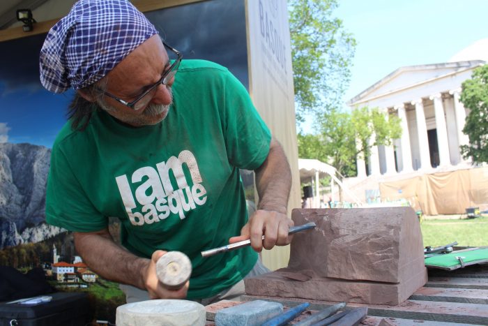 Bernat carving the carvel that he has given to the Smithsonian, on the National Mall at the 2016 Smithsonian Folklife Festival. Photo by SarahVictoria Rosemann