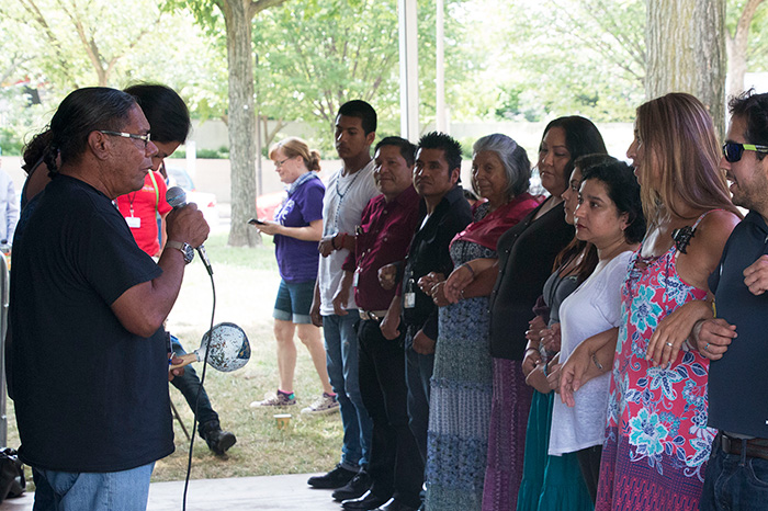 Stan Rodriguez leads a traditional Kumeyaay song. His wife Marta, here in the black top and purple skirt, leads the accompanying dance. Photo by Hank Douglas, Ralph Rinzler Folklife Archives