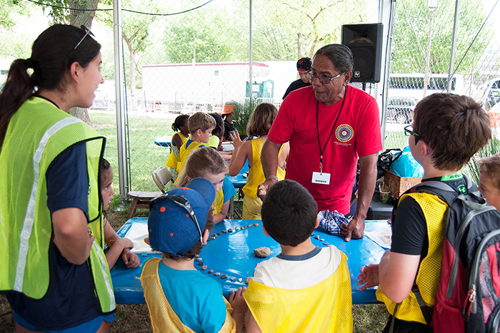 Stan Rodriguez introduces a group of young Festival visitors to a Kumeyaay game. Photo by Joe Furgal, Ralph Rinzler Folklife Archives