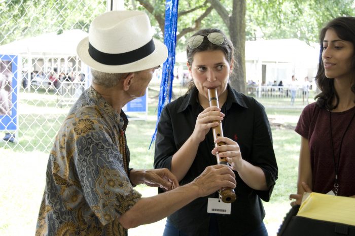 Abe shows members from the Armenia youth rock band TmbaTa how to play the shakuhachi. Photo by SarahVictoria Rosemann