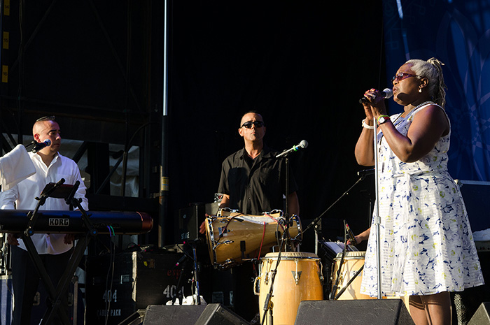 The John Santos Sextet was joined at the Festival by vocalist Bobi Céspedes. Here, Santos is playing a commercially manufactured set of batá drums for popular performance, rather than drums used for sacred traditions. Photo by Josh Weilepp, Ralph Rinzler Folklife Archives