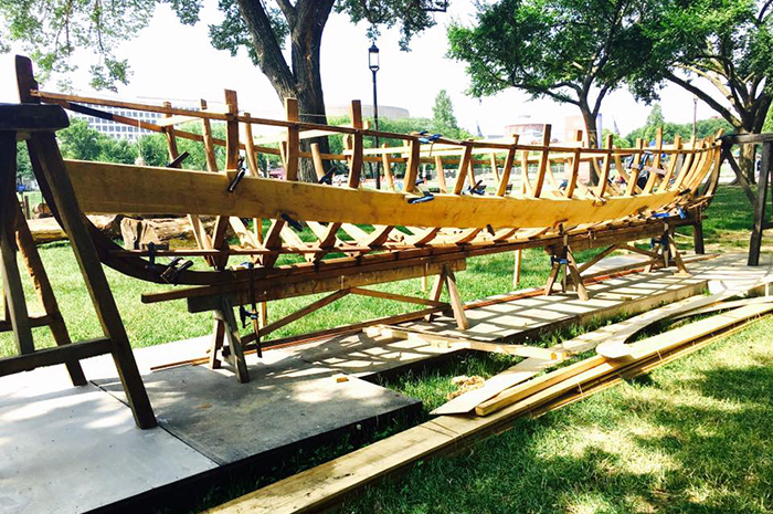 Boat builders from Albaola demonstrated traditional techniques on this <em>txalupa</em> skeleton. Photo by Robin Morey