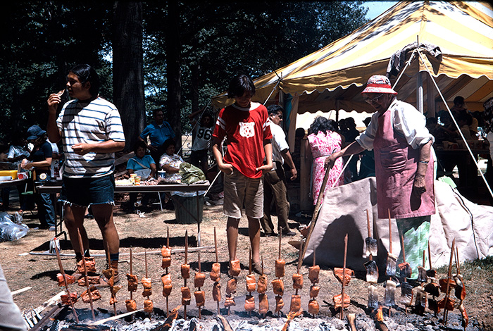 Visitors at the 1974 Folklife Festival could learn the salmon roasting method and taste test the results. Photo by Reed & Susan Erskine, Ralph Rinzler Folklife Archives