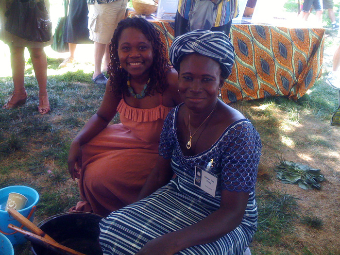 Rahama Wright (left) with Gladys Sala Petey, who supervises production teams in Ghana, take a break from their demonstrations in the Peace Corps program of the 2011 Festival