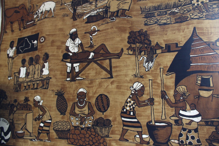 Painted textile depicting Peace Corps work in Mali