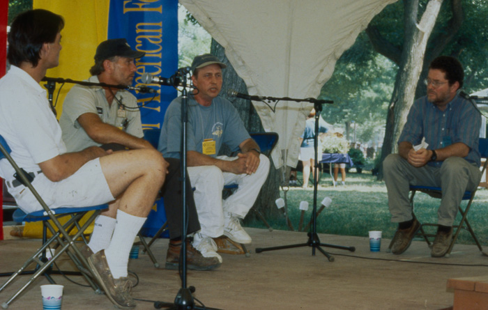 Peter Seitel moderates a conversation on the narrative stage of the 1996 “Working at the Smithsonian” Festival program.