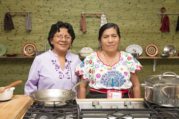 Manuela Ayasta and Margarita Guzmán demonstrated how to cook garbanzos norteños, a traditional dish from Monsefú. Photo by Pruitt Allen, Ralph Rinzler Folklife Archives