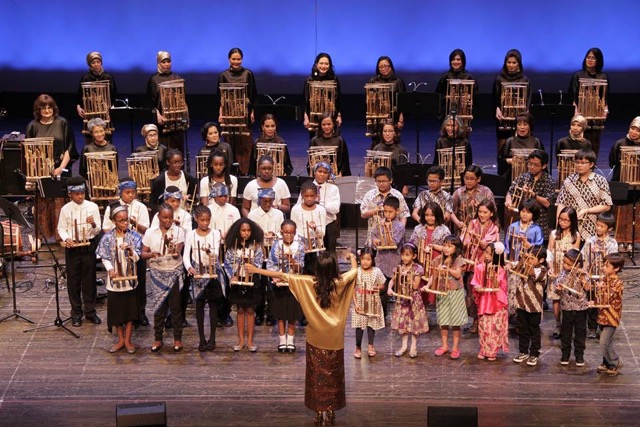 Rumah Indonesia teaches students to play the <em>angklung</em>, a bamboo rattle. Each instrument only plays one note, but played together in a group they can create melodies. Photo courtesy of Rumah Indonesia