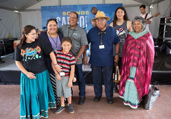 The Rodriguezes and the Arrow-weeds pose after the "Native Song Traditions" performance on the Sounds of California Stage & Plaza. Photo by Francisco Guerra, Ralph Rinzler Folklife Archives