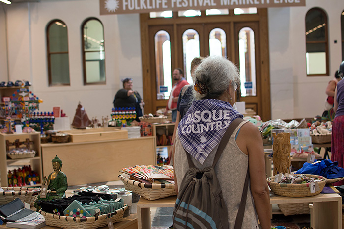 This is the first year the Festival Marketplace has been inside the Arts and Industries Building, which has been shuttered for twelve years. Inside you'll find crafts by Basque and Californian artists, plus merchandise from past Festivals. Photo by Olivia Boyle, Ralph Rinzler Folklife Archives